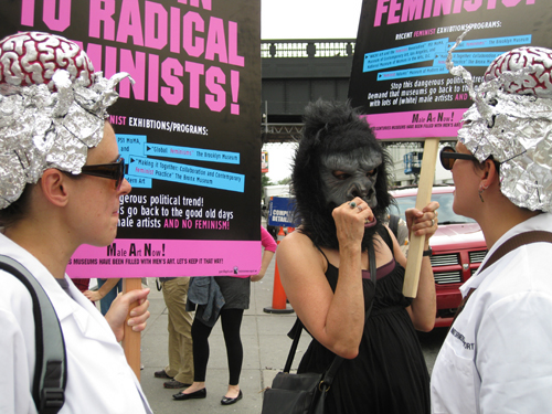 Brainstormers and the Guerrilla Girls street action in Chelsea. The Brainstormers are Maria Dumlao, Elaine Kaufmann, Danielle Mysliwiec, and Anne Polashenski.